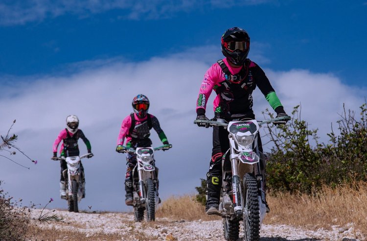 Three dirt-bike riders on a rocky trail at Sayious Adventure Park
