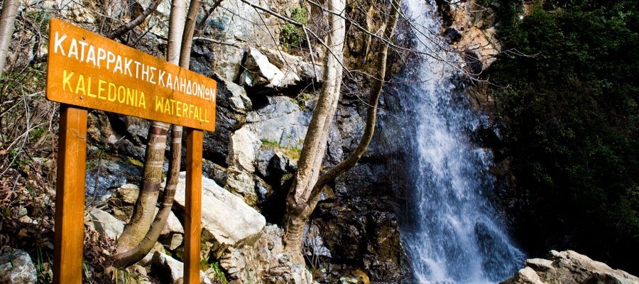 Kalidonia Waterfall beside its wooden trail sign